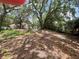 Backyard featuring mature trees, a hammock, and plenty of room for outdoor activities and relaxation at 578 3Rd St, Daytona Beach, FL 32117