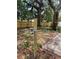 Tranquil backyard area surrounded by lush greenery and a sturdy wooden fence for added privacy at 578 3Rd St, Daytona Beach, FL 32117