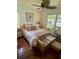 Bedroom featuring hardwood floors, a ceiling fan, and natural light at 578 3Rd St, Daytona Beach, FL 32117