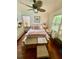 Bright bedroom with hardwood floors, a ceiling fan, and natural light at 578 3Rd St, Daytona Beach, FL 32117