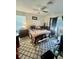 Bedroom featuring patterned carpets, natural light, and a ceiling fan at 578 3Rd St, Daytona Beach, FL 32117