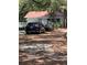 View of house with dark blue car in driveway at 578 3Rd St, Daytona Beach, FL 32117