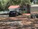 Image of House with red roof and dark blue car parked in the driveway at 578 3Rd St, Daytona Beach, FL 32117
