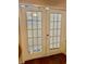 White French doors with glass panes and blinds allowing for lots of natural light at 578 3Rd St, Daytona Beach, FL 32117