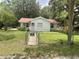 A quaint single-story home featuring a manicured front lawn and a charming picket fence at 578 3Rd St, Daytona Beach, FL 32117