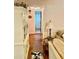 Hallway with hardwood floors leading to a bathroom with a shower/tub combination at 578 3Rd St, Daytona Beach, FL 32117