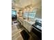 Well-lit kitchen featuring granite countertops, stylish cabinets, and modern appliances at 578 3Rd St, Daytona Beach, FL 32117