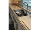 Kitchen sink features white cabinets, granite counters, and a stainless steel faucet at 578 3Rd St, Daytona Beach, FL 32117