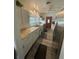 Bright kitchen features granite counters, stainless steel appliances and wood look floors at 578 3Rd St, Daytona Beach, FL 32117