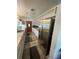 Efficient kitchen layout with stainless steel refrigerator, wood door, and ample counter space at 578 3Rd St, Daytona Beach, FL 32117