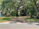 Image of land with mature trees and green grass and street view at 578 3Rd St, Daytona Beach, FL 32117