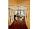 A light-filled office featuring wood floors and views of the outdoor pool at 578 3Rd St, Daytona Beach, FL 32117