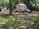 View of the storage shed with a pile of items behind it at 578 3Rd St, Daytona Beach, FL 32117