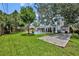 Manicured backyard featuring a pool, bocce court, and covered patio at 624 Richmond Street, Orlando, FL 32806