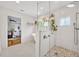 Bright bathroom featuring a glass enclosed shower, soaking tub, and stylish tile at 624 Richmond Street, Orlando, FL 32806
