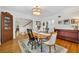 Bright dining room features a wooden table, hardwood floors, and elegant chandelier at 624 Richmond Street, Orlando, FL 32806
