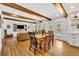 Open floor plan of dining room and living room featuring hardwood floors and exposed wood beams at 624 Richmond Street, Orlando, FL 32806