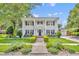 Classic colonial home featuring a manicured lawn, brick pathway, and stately white columns for curb appeal at 624 Richmond Street, Orlando, FL 32806