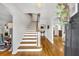 Bright foyer showcasing a staircase with hardwood treads and open access to other living spaces at 624 Richmond Street, Orlando, FL 32806