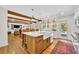 Bright, open kitchen with a large island, white marble countertops, and backyard view at 624 Richmond Street, Orlando, FL 32806