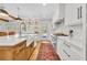 Bright kitchen with stainless appliances, farmhouse sink, and backyard view at 624 Richmond Street, Orlando, FL 32806
