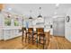 Bright kitchen with an island and bar stool seating, stainless appliances, and plenty of storage at 624 Richmond Street, Orlando, FL 32806