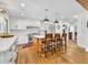 Modern kitchen with white cabinets, a center island, and stainless steel appliances at 624 Richmond Street, Orlando, FL 32806