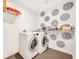 Modern laundry room featuring a front load washer and dryer with decorative wall accents at 624 Richmond Street, Orlando, FL 32806