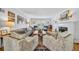 Bright living room features hardwood floors, a decorative fireplace and elegant furnishings at 624 Richmond Street, Orlando, FL 32806