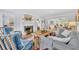 An inviting living room with a fireplace, hardwood floors, and comfortable seating arrangements at 624 Richmond Street, Orlando, FL 32806