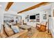 Spacious living room featuring hardwood floors, exposed wood beams, and an open layout at 624 Richmond Street, Orlando, FL 32806