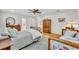 This is an image of a main bedroom suite with hardwood floors and sitting area at 624 Richmond Street, Orlando, FL 32806