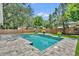 Inviting backyard pool with brick pavers and lush landscaping at 624 Richmond Street, Orlando, FL 32806
