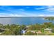 Aerial view of the surrounding landscape, trees, and lake at 6501 Matchett Rd, Belle Isle, FL 32809