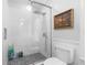 Modern bathroom with glass shower, white subway tile, and stylish fixtures at 6501 Matchett Rd, Belle Isle, FL 32809
