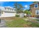 Spacious detached garage with a clean white door and a well-kept yard at 6501 Matchett Rd, Belle Isle, FL 32809