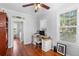 Home office with desk, chair, shelving, and views to the exterior at 6501 Matchett Rd, Belle Isle, FL 32809