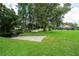 Sprawling backyard with a pond, dock, and a kayak launch at 6720 Winter Garden Vineland Rd, Windermere, FL 34786