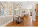 Bright breakfast nook with views of the living room and backyard at 6720 Winter Garden Vineland Rd, Windermere, FL 34786