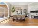 Bright dining room featuring a large window, modern lighting, and stylish decor at 6720 Winter Garden Vineland Rd, Windermere, FL 34786