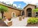 Inviting courtyard with a water fountain, elegant accents and walkway to double front doors at 6720 Winter Garden Vineland Rd, Windermere, FL 34786