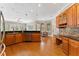 Spacious kitchen with wood cabinets, granite countertops, and stainless steel appliances at 6720 Winter Garden Vineland Rd, Windermere, FL 34786