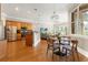 Open kitchen boasts stainless appliances, wood cabinets and an adjacent breakfast nook at 6720 Winter Garden Vineland Rd, Windermere, FL 34786