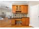 Kitchen cabinet with granite countertop perfect for a coffee bar or wine storage at 6720 Winter Garden Vineland Rd, Windermere, FL 34786