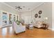 Cozy living room featuring elegant furniture, high ceilings, and access to the outdoor patio at 6720 Winter Garden Vineland Rd, Windermere, FL 34786