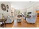 Open-concept living room with modern decor, fireplace, and easy access to dining and kitchen areas at 6720 Winter Garden Vineland Rd, Windermere, FL 34786