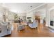 Bright, open-concept living space with hardwood floors, fireplace, and seamless flow to dining and kitchen areas at 6720 Winter Garden Vineland Rd, Windermere, FL 34786
