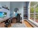 Comfortable office with built-in shelves, a bright window, and modern desk setup at 6720 Winter Garden Vineland Rd, Windermere, FL 34786