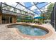 Sparkling pool with attached spa and a spacious, screened lanai for entertaining at 6720 Winter Garden Vineland Rd, Windermere, FL 34786