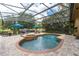 Inviting pool with spa and screened enclosure, perfect for outdoor relaxation at 6720 Winter Garden Vineland Rd, Windermere, FL 34786